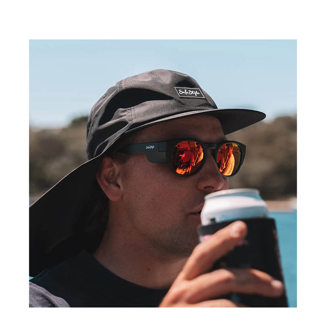 SafeStyle Cruisers Matte Black Frame Mirror Red Polarised Lens worn by man in a black hat holding a beverage