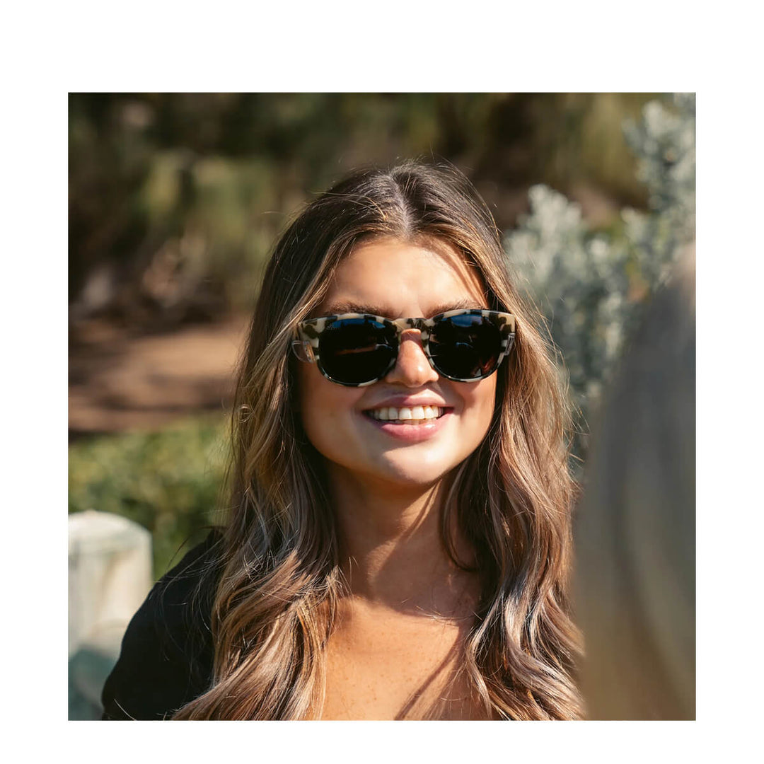 SafeStyle Cruisers Milky Tort Frame Polarised Lens worn by smiling woman