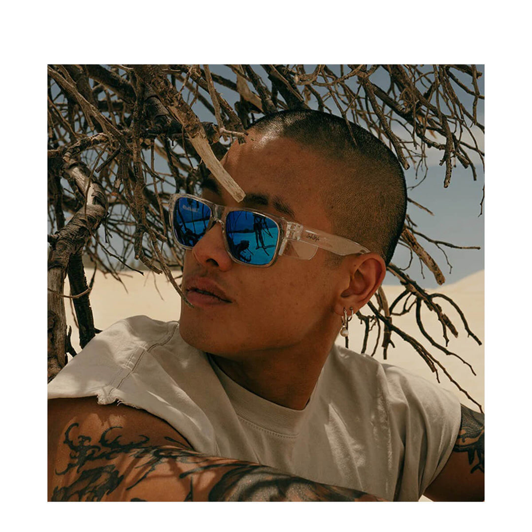 SafeStyle Fusions Clear Frame Mirror Blue Polarised Lens worn by tattooed man in a white tee