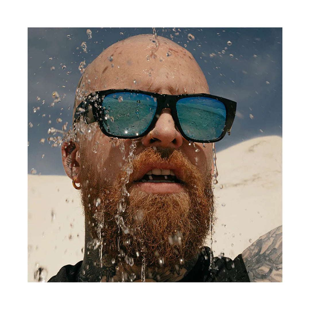 SafeStyle Fusions Matte Black Frame Mirror Blue Polarised Lens worn by man getting splashed by water