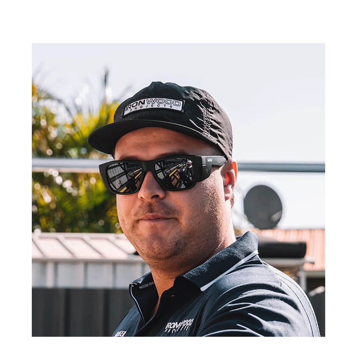 SafeStyle Fusions XL Matte Black Frame Polarised Lens Worn by Man in Cap head on