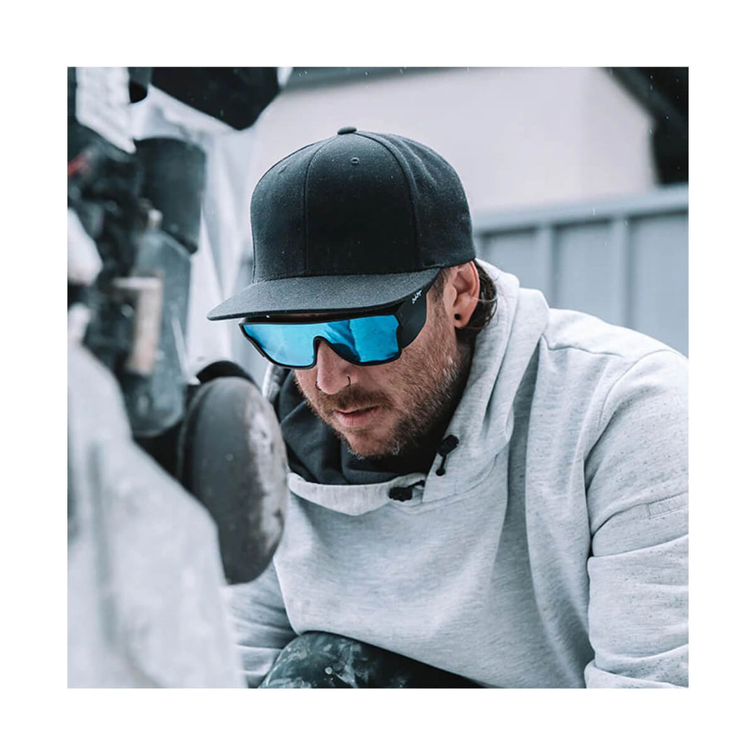 SafeStyle Primes Matte Black Frame Reflectors Blue Lens worn by man in cap