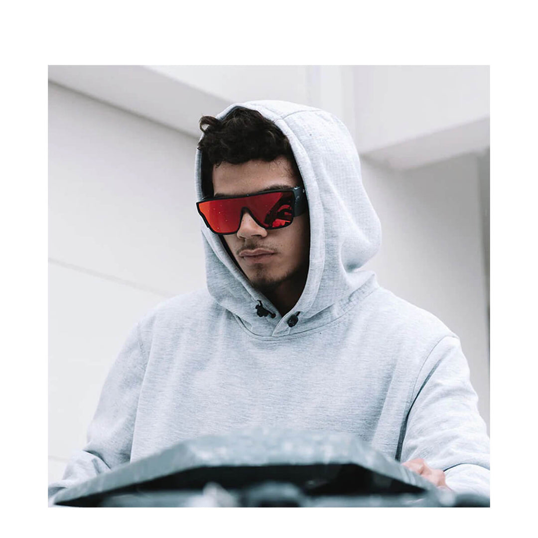 SafeStyle Primes Matte Black Frame Reflectors Red Lens Worn by Man in Grey Hoodie